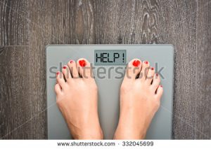 stock-photo-lose-weight-concept-with-person-on-a-scale-measuring-kilograms-332045699